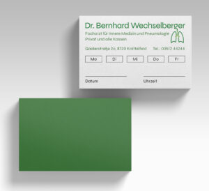 The front and back of the appointment card, with the one-lined version of the logo and appointment info in the front and a solid green in the back.